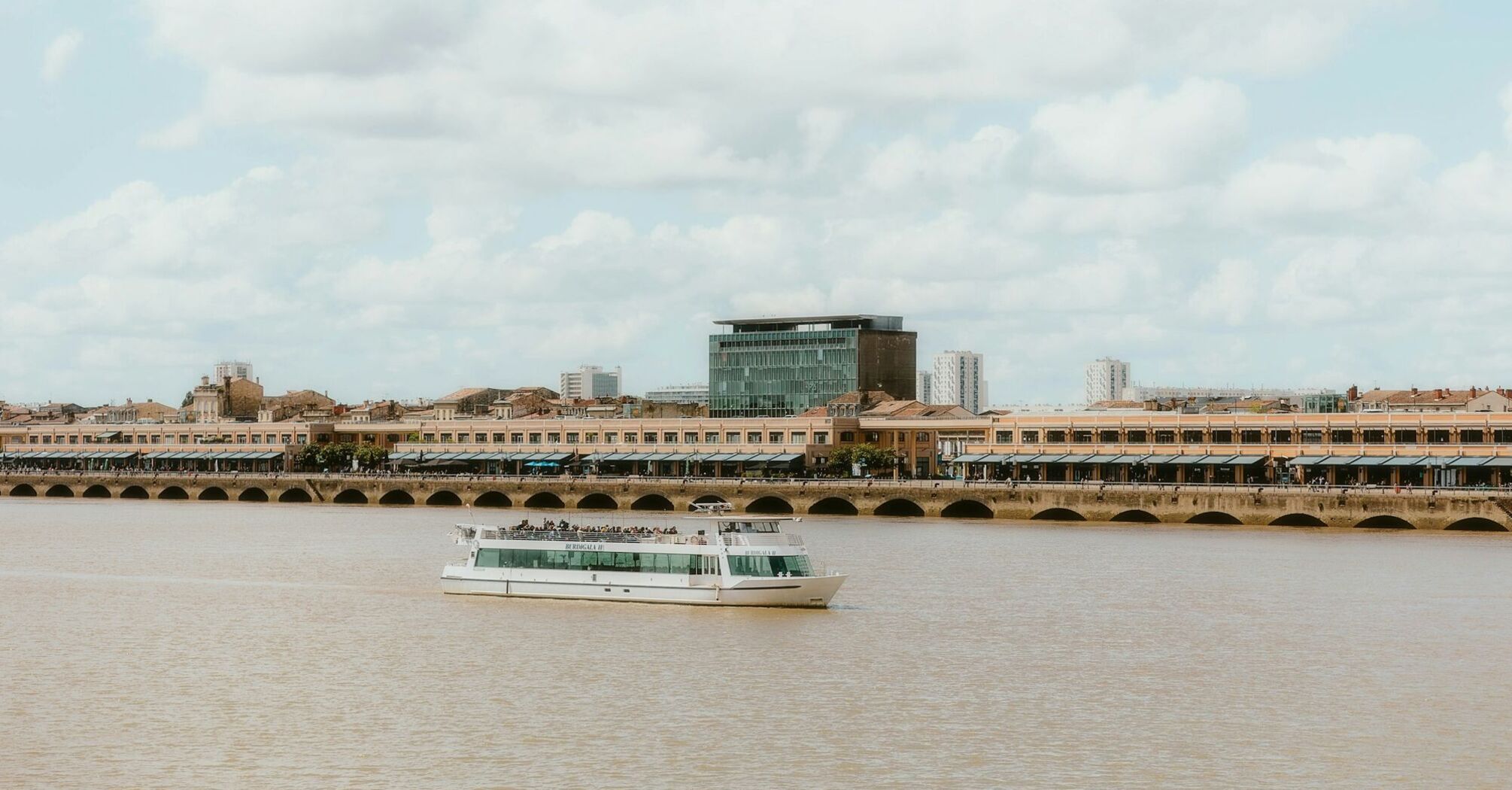 River cruise boat on Garonne River in Bordeaux