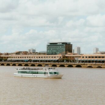 River cruise boat on Garonne River in Bordeaux