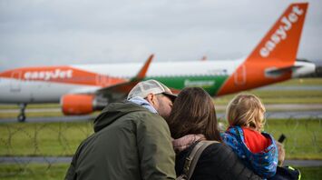 easyJet aircraft on runway with passengers watching