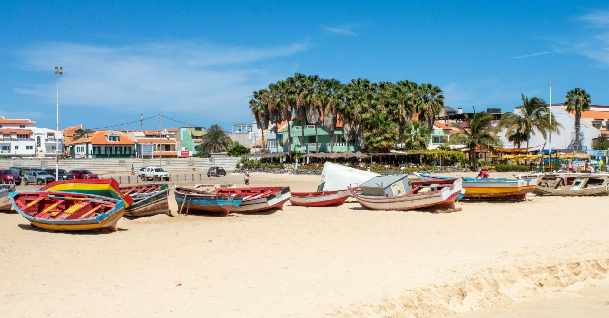 Colourful fishing boats on sandy beach in Sal, Cape Verde
