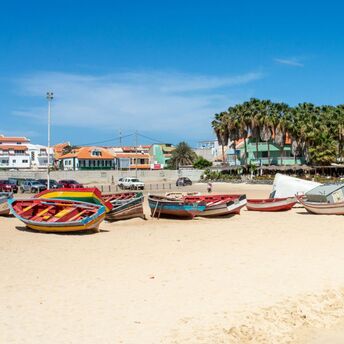 Colourful fishing boats on sandy beach in Sal, Cape Verde
