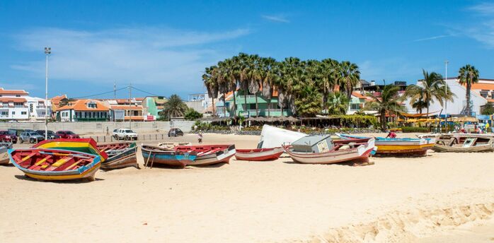 Colourful fishing boats on sandy beach in Sal, Cape Verde