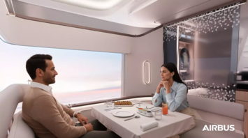 Two passengers dining inside Airbus A350 First Class suite with large window view