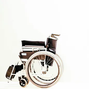 Manual wheelchair isolated on light background