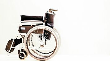 Manual wheelchair isolated on light background