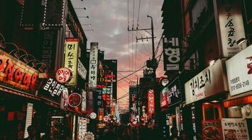 Seoul street with neon signs and restaurants