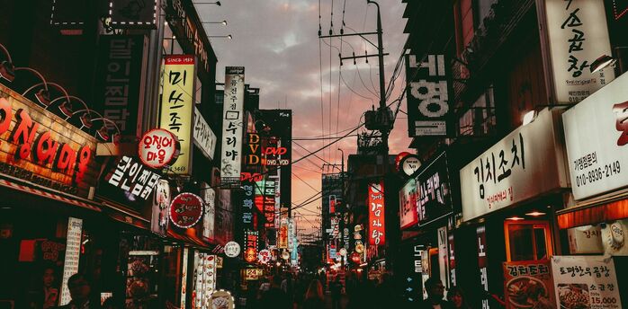 Seoul street with neon signs and restaurants