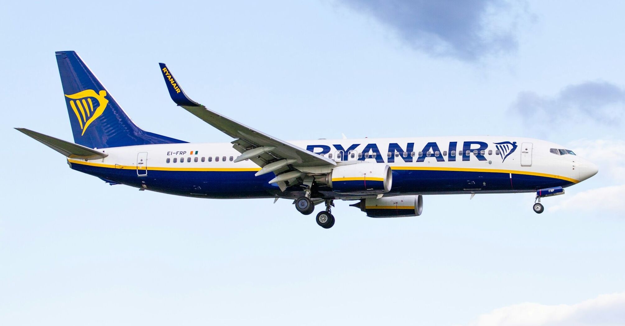 Ryanair aircraft in flight against blue sky