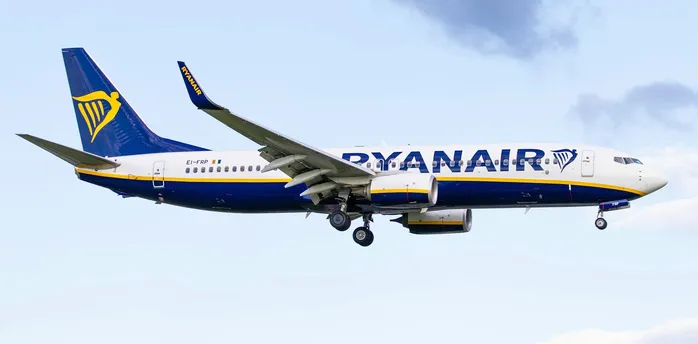 Ryanair aircraft in flight against blue sky