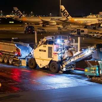 Runway resurfacing works taking place at airport apron at night