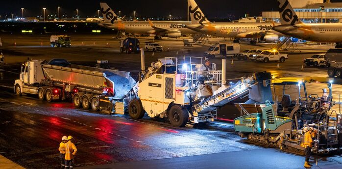 Runway resurfacing works taking place at airport apron at night