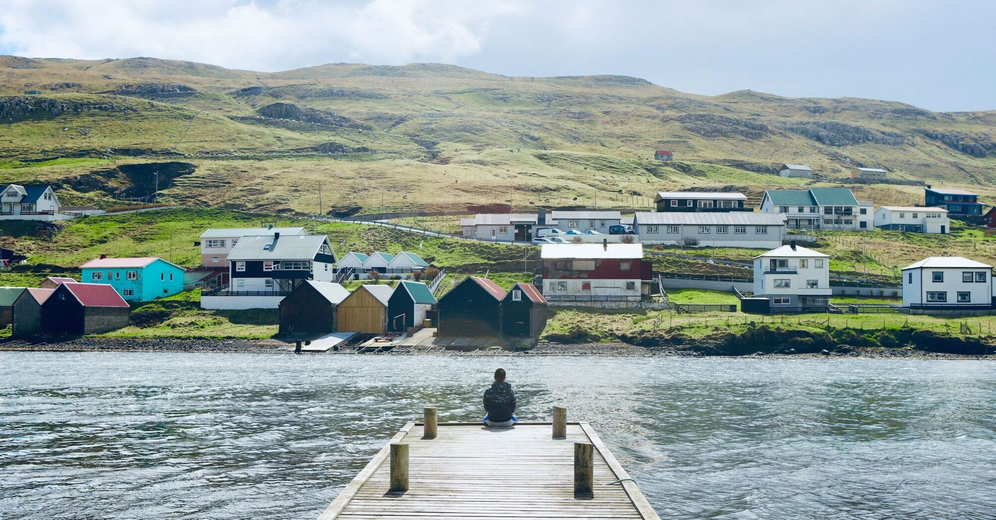 Qaqortoq coastal settlement with colourful houses and green hills by the fjord