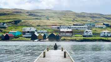 Qaqortoq coastal settlement with colourful houses and green hills by the fjord