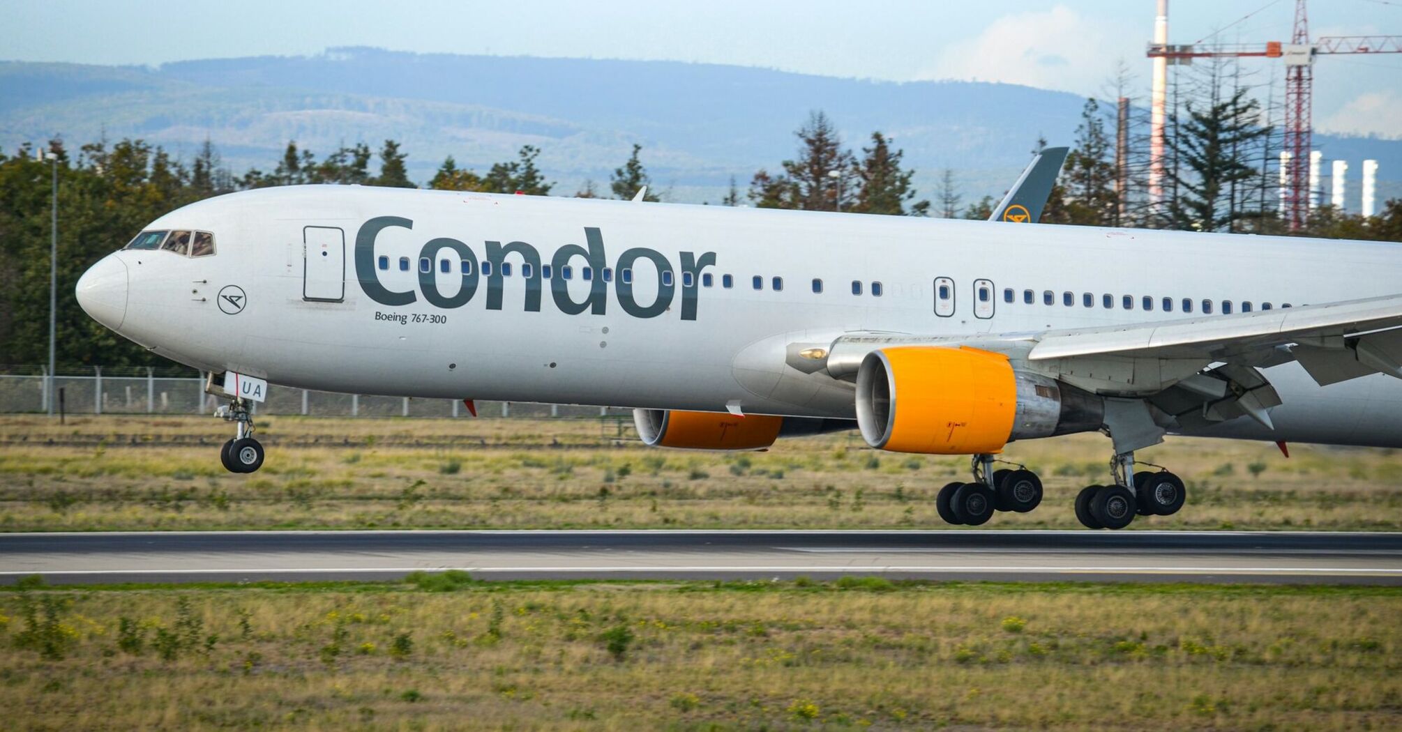 Condor aircraft taking off from runway