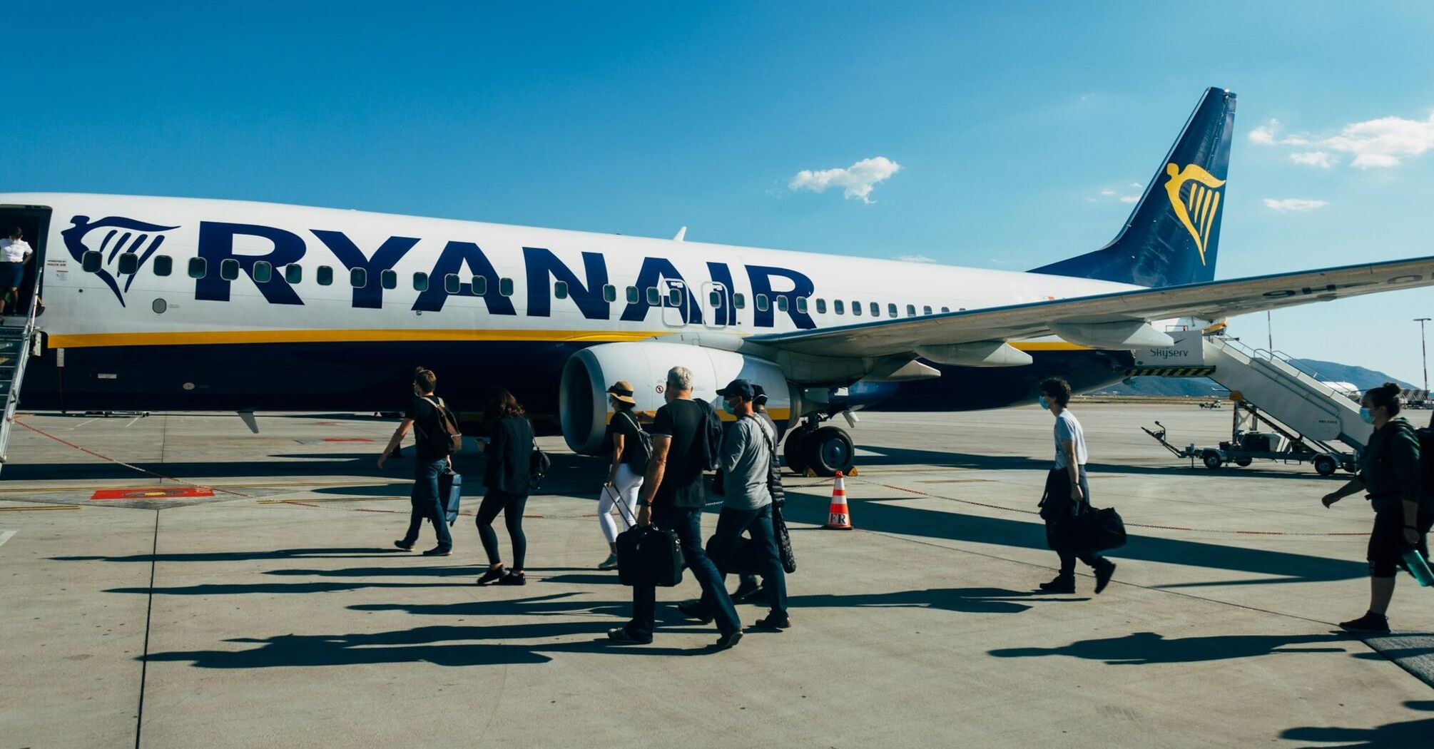 Ryanair aircraft on the runway with passengers boarding
