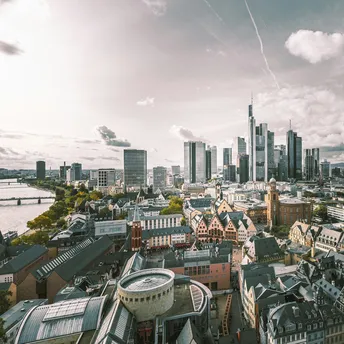 Frankfurt skyline with modern skyscrapers and historic buildings along the river