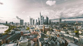 Frankfurt skyline with modern skyscrapers and historic buildings along the river