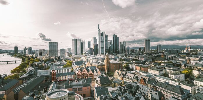 Frankfurt skyline with modern skyscrapers and historic buildings along the river