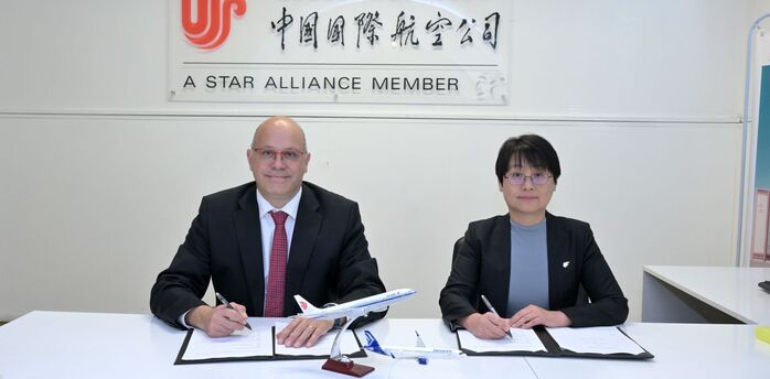 AEGEAN and Air China representatives signing codeshare agreement in office