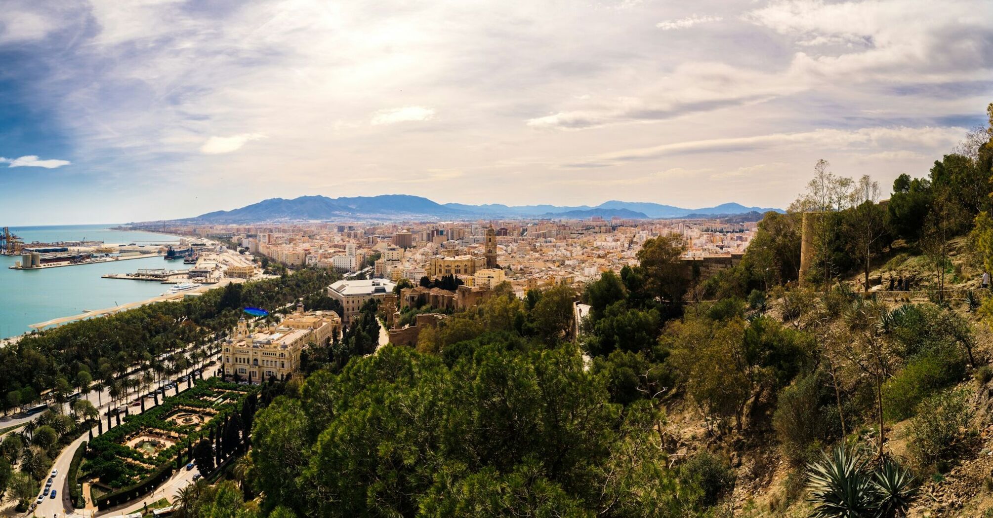 View of Malaga city with coastline and harbour in Spain