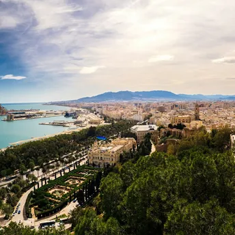 View of Malaga city with coastline and harbour in Spain