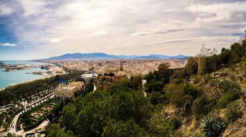 View of Malaga city with coastline and harbour in Spain