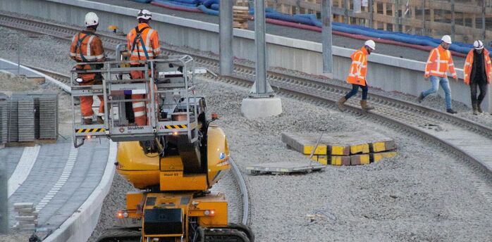 Rail workers carrying out maintenance on tracks