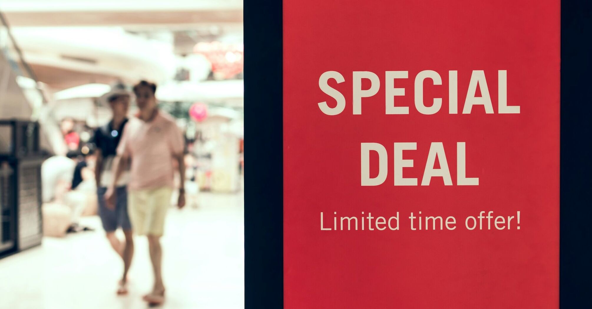 Red special deal sign inside shopping centre