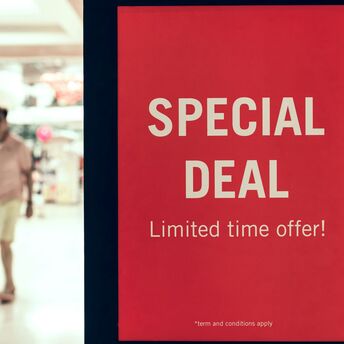 Red special deal sign inside shopping centre