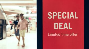 Red special deal sign inside shopping centre