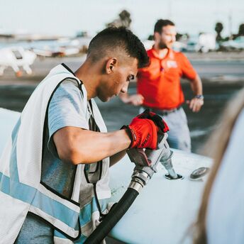 Aircraft refuelling on airport apron before departure