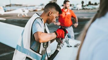 Aircraft refuelling on airport apron before departure