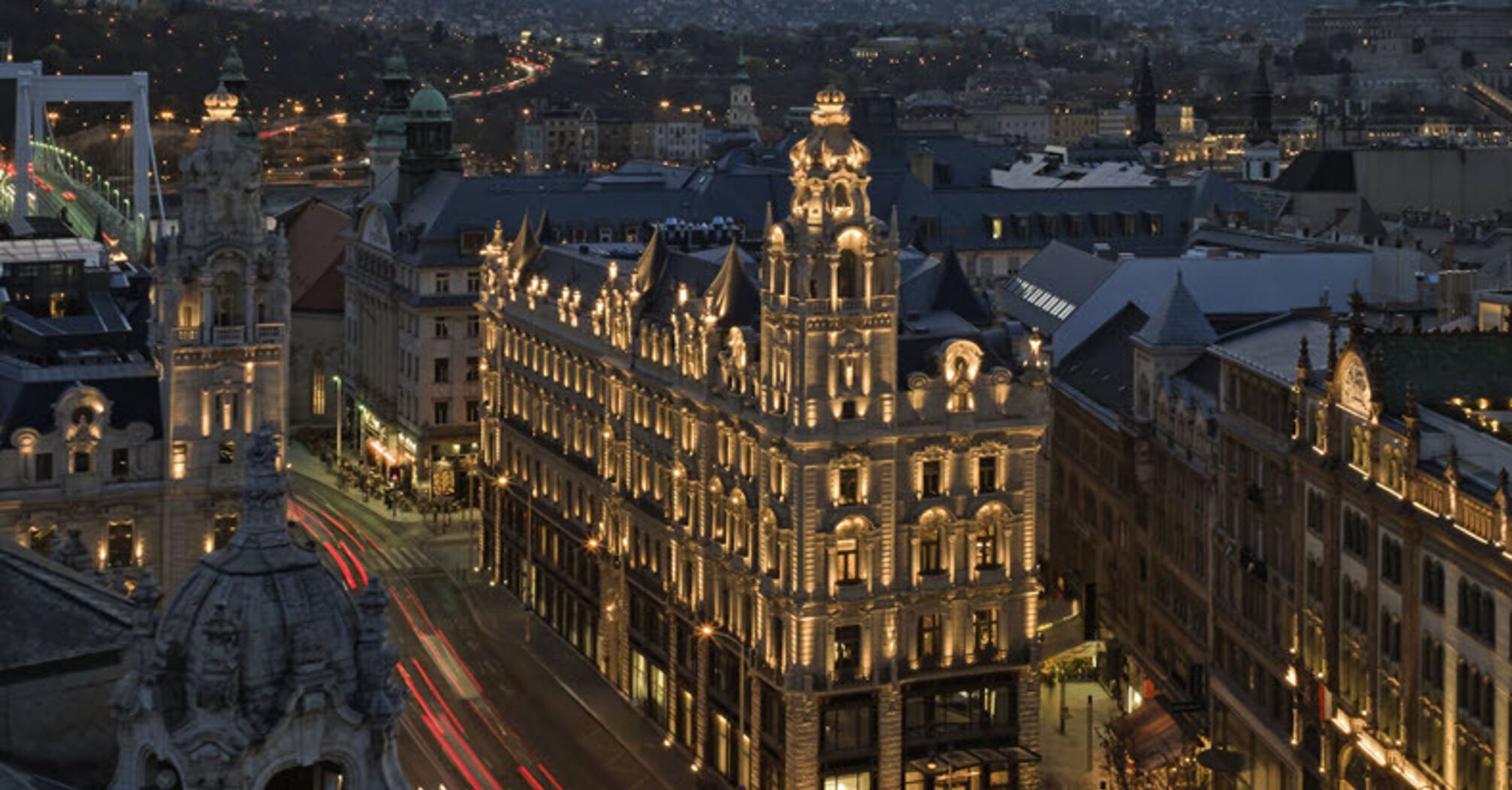 Klotild Palace in Budapest illuminated at dusk, home to The St. Regis Budapest