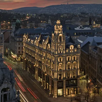 Klotild Palace in Budapest illuminated at dusk, home to The St. Regis Budapest