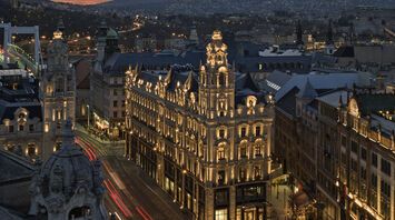 Klotild Palace in Budapest illuminated at dusk, home to The St. Regis Budapest