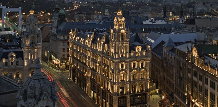 Klotild Palace in Budapest illuminated at dusk, home to The St. Regis Budapest