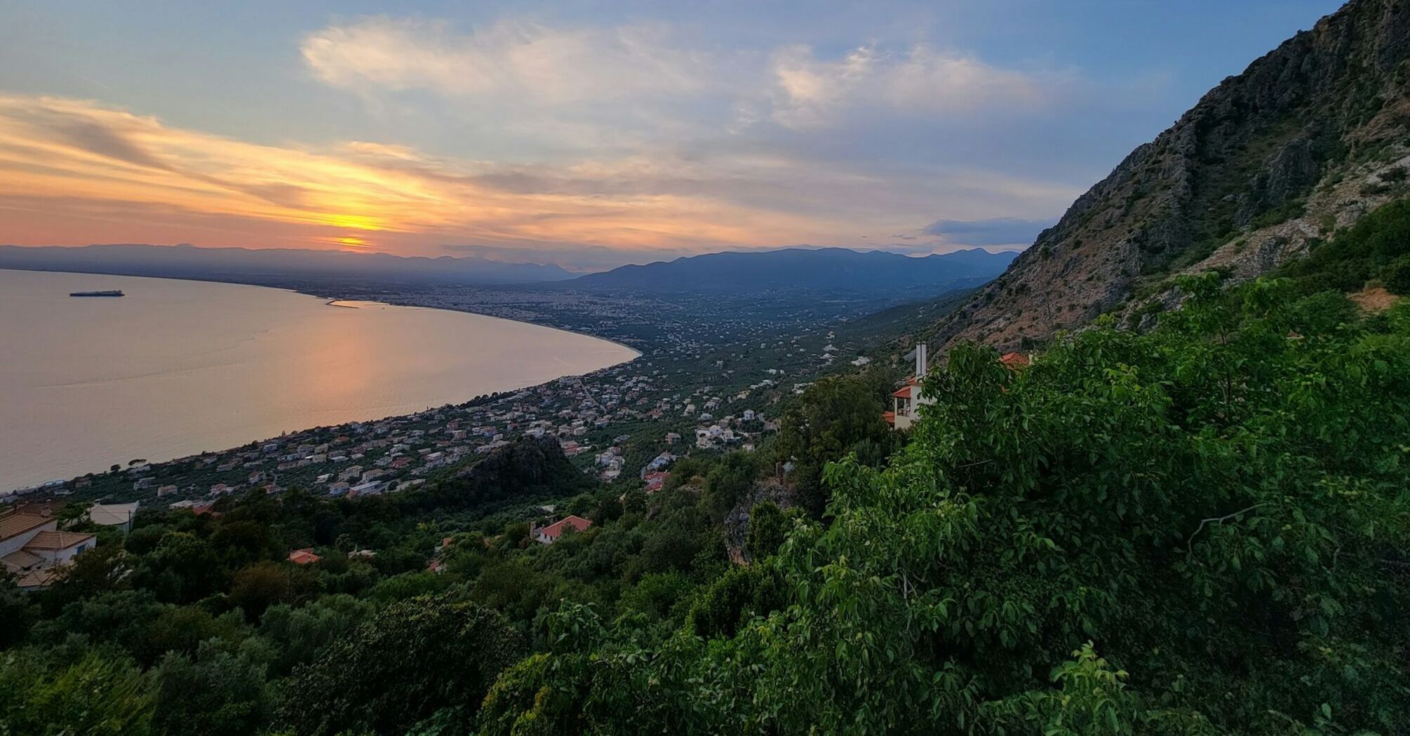 Kalamata coastline at sunset with bay and mountains