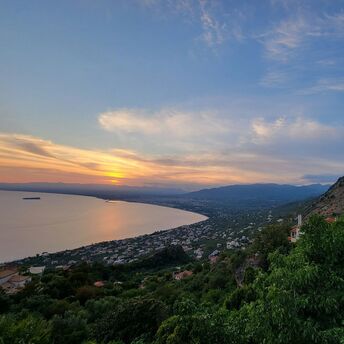 Kalamata coastline at sunset with bay and mountains