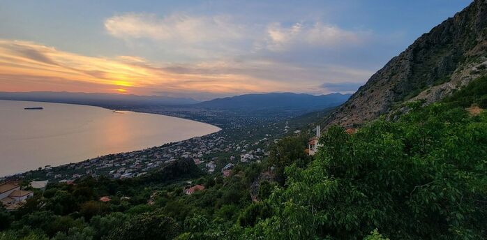 Kalamata coastline at sunset with bay and mountains