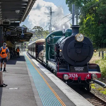Vintage steam locomotive at small rural station platform