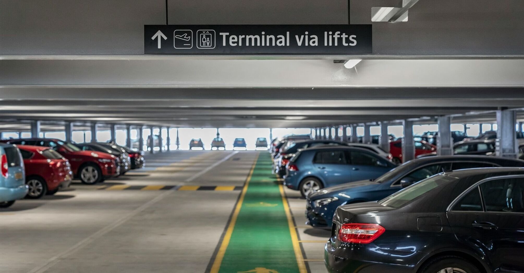 Airport car park with terminal access sign
