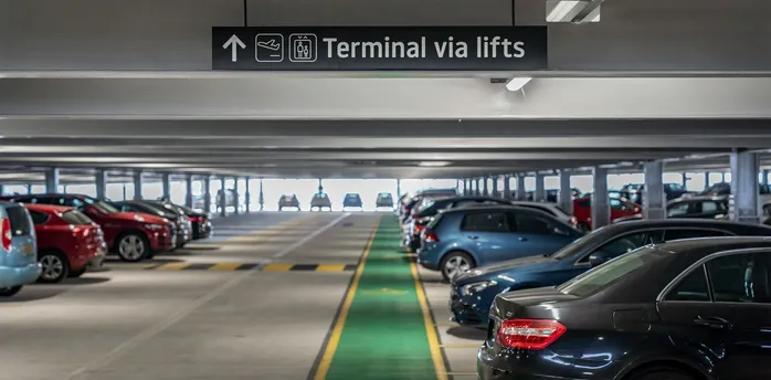 Airport car park with terminal access sign