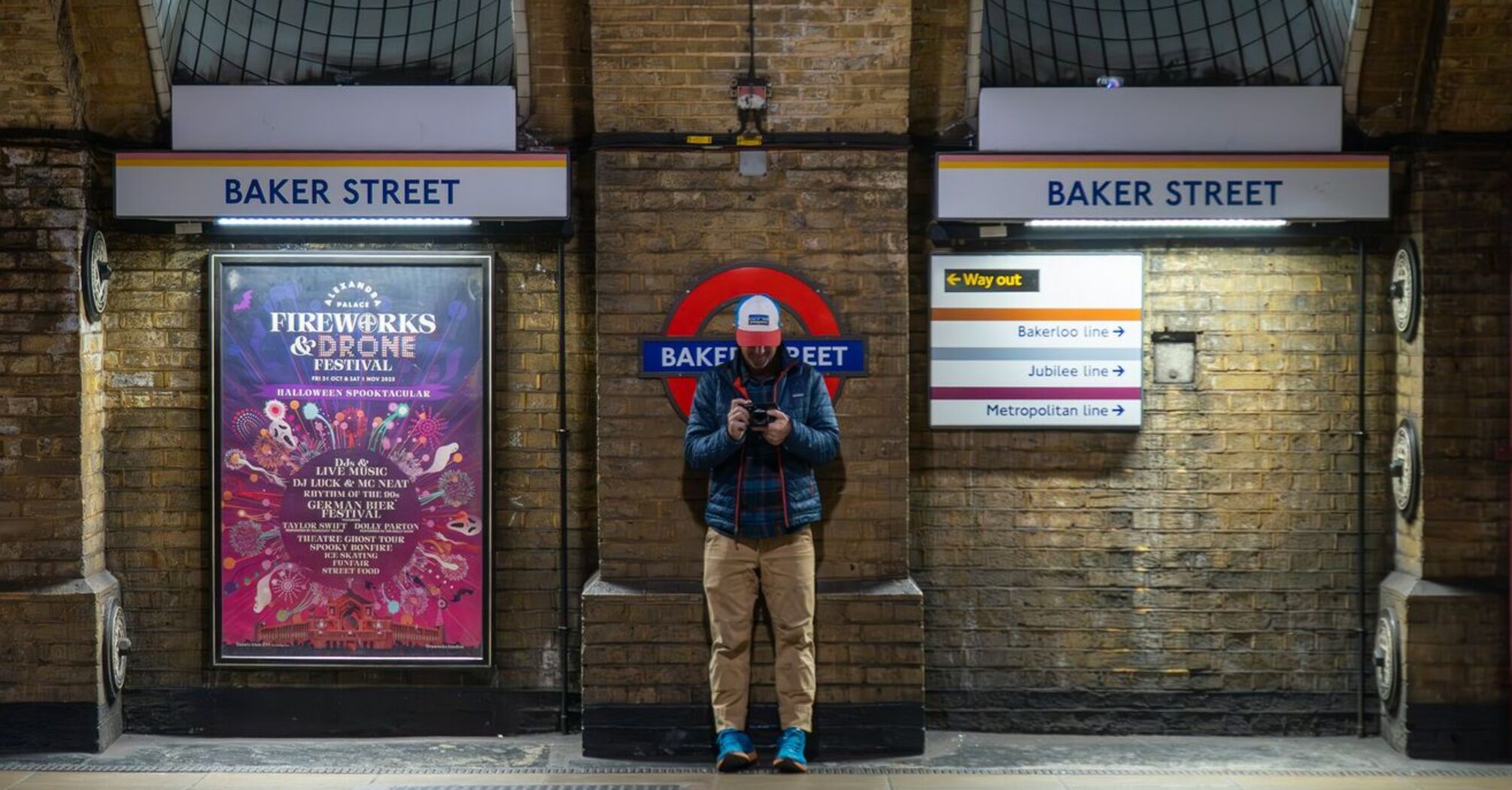 Passenger standing on Baker Street Underground platform in London