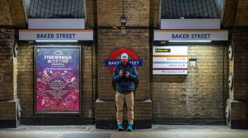Passenger standing on Baker Street Underground platform in London