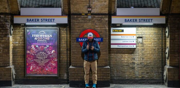 Passenger standing on Baker Street Underground platform in London