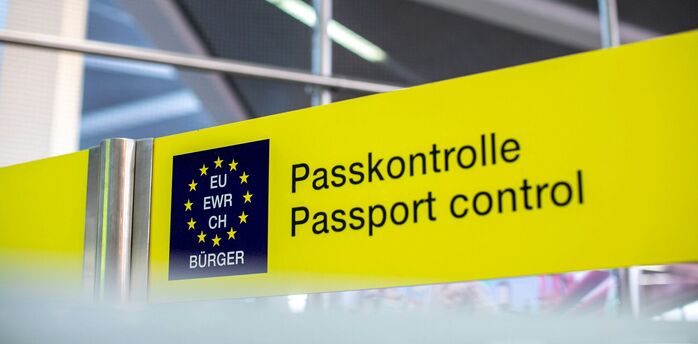 Passport control sign at European airport border checkpoint