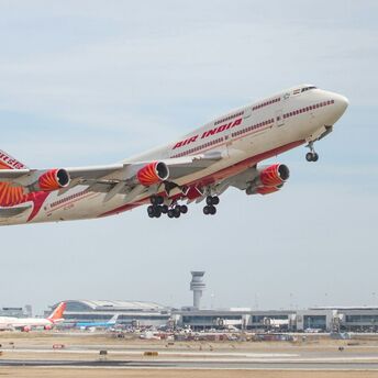 Air India aircraft taking off from airport runway