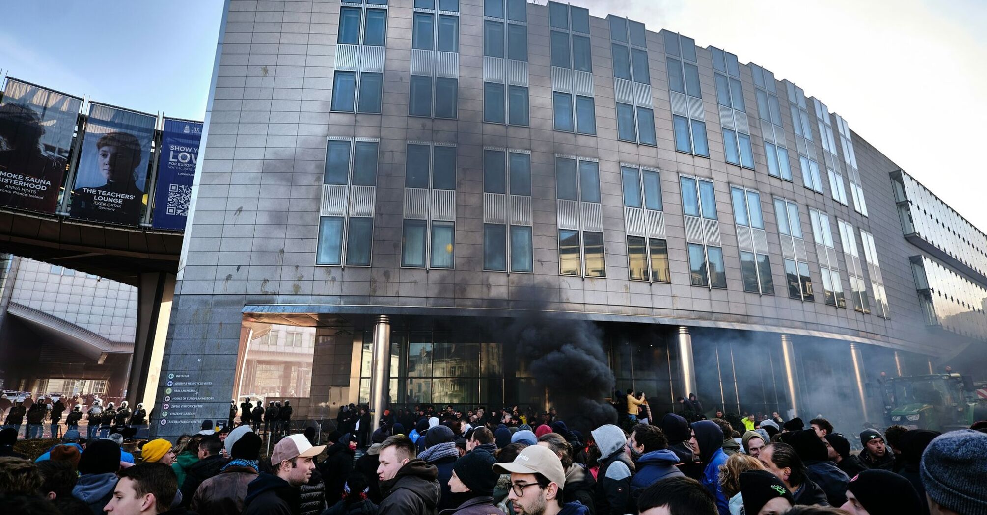 Crowd gathered near smoke outside a Brussels building