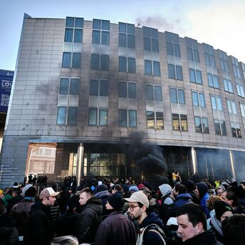 Crowd gathered near smoke outside a Brussels building