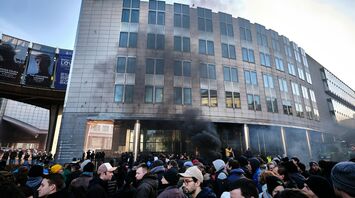 Crowd gathered near smoke outside a Brussels building